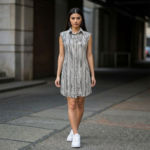 Black-and-white-vertical-striped-sleeveless-shirt-dress-with-collar-and-button-down-front