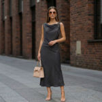 Woman-charcoal-grey-sleeveless-dress-with-draped-neckline
