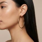 Women’s-gold-tone hoop earrings with minimalist thin circular design and latch-back closure
