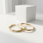 Women’s-gold-tone-twisted-hoop-earrings-with-layered-braided-design-and-polished-metallic-finish