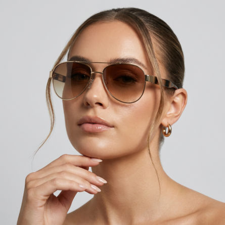 Women’s-gold-frame-aviator-sunglasses-with-brown-gradient-tinted-lenses-and-thin-metal-frame