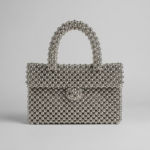 Silver-beaded-handbag-with-top-handle-and-flap-closure-structured-evening-bag