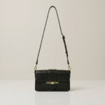 Black-structured-flap-shoulder-bag-with-gold-hardware-and-adjustable-crossbody-strap
