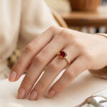 Gold-tone-red-gemstone-ring-with-crystal-accent-for-women