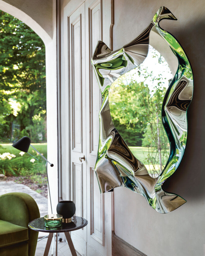 Christine is a designer wall mirror produced by Fiam and offered by Peverelli