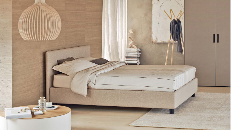 This photo shows the modern double bed by the company Flou