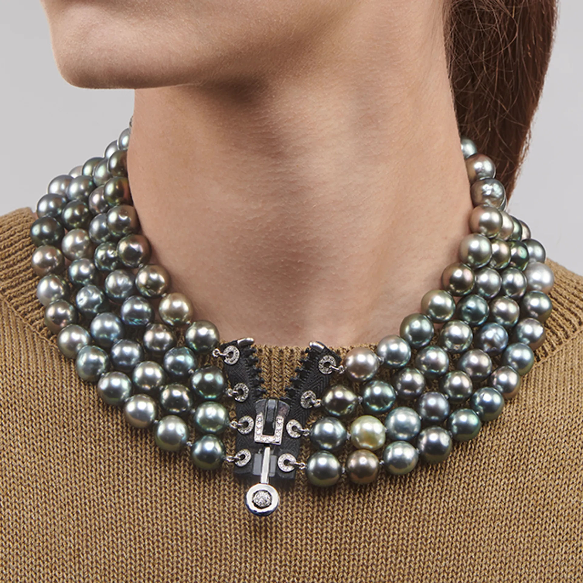 Close up image of the Tahitian Pearl Zip Necklace with Diamonds by Patrice Fabre worn by @celinemarechal