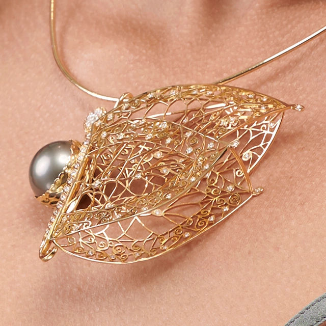 Close up of Butterfly Tahitian Pearl Yellow Gold Lace Pendant