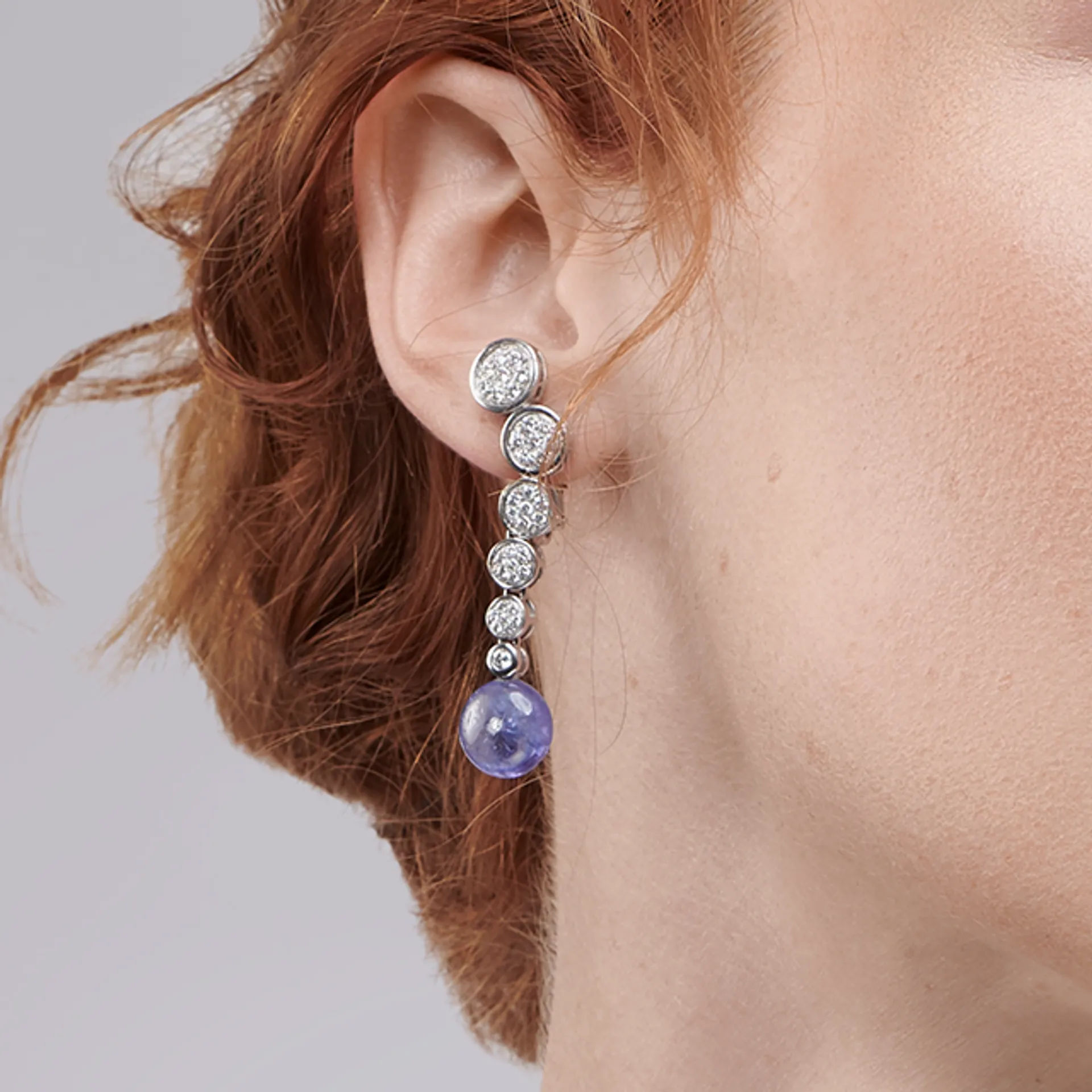 Close up image of the Cascade White Gold Earrings with Tanzanite and Diamonds by Patrice Fabre worn by @lucy.m.w