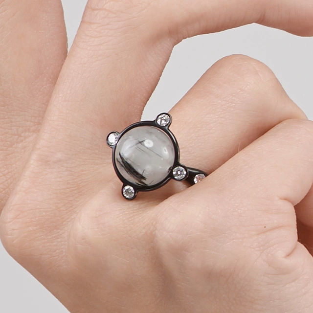 Close up of Rutile Quartz Diamond Orbitale Ring