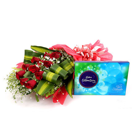 12 Red Roses in Red Paper Packing with Cadbury Celebration Box