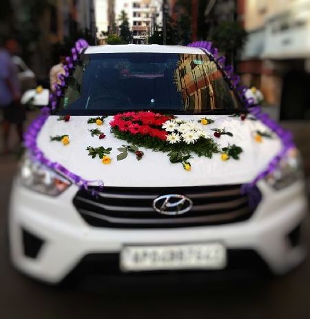 Car Deco with 2 Arrangements and 50 Mix Roses