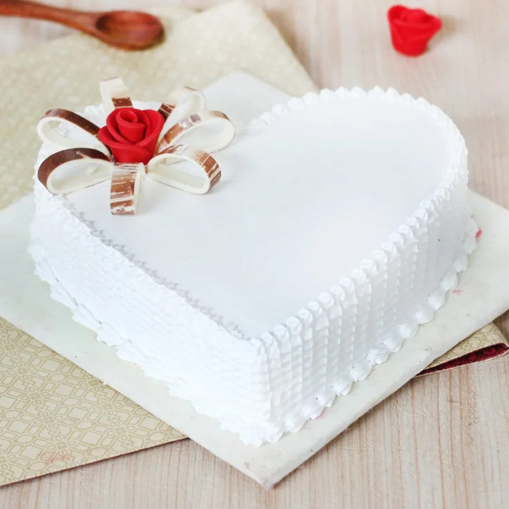 Heart Shaped Vanilla Cake With Flower Brooch