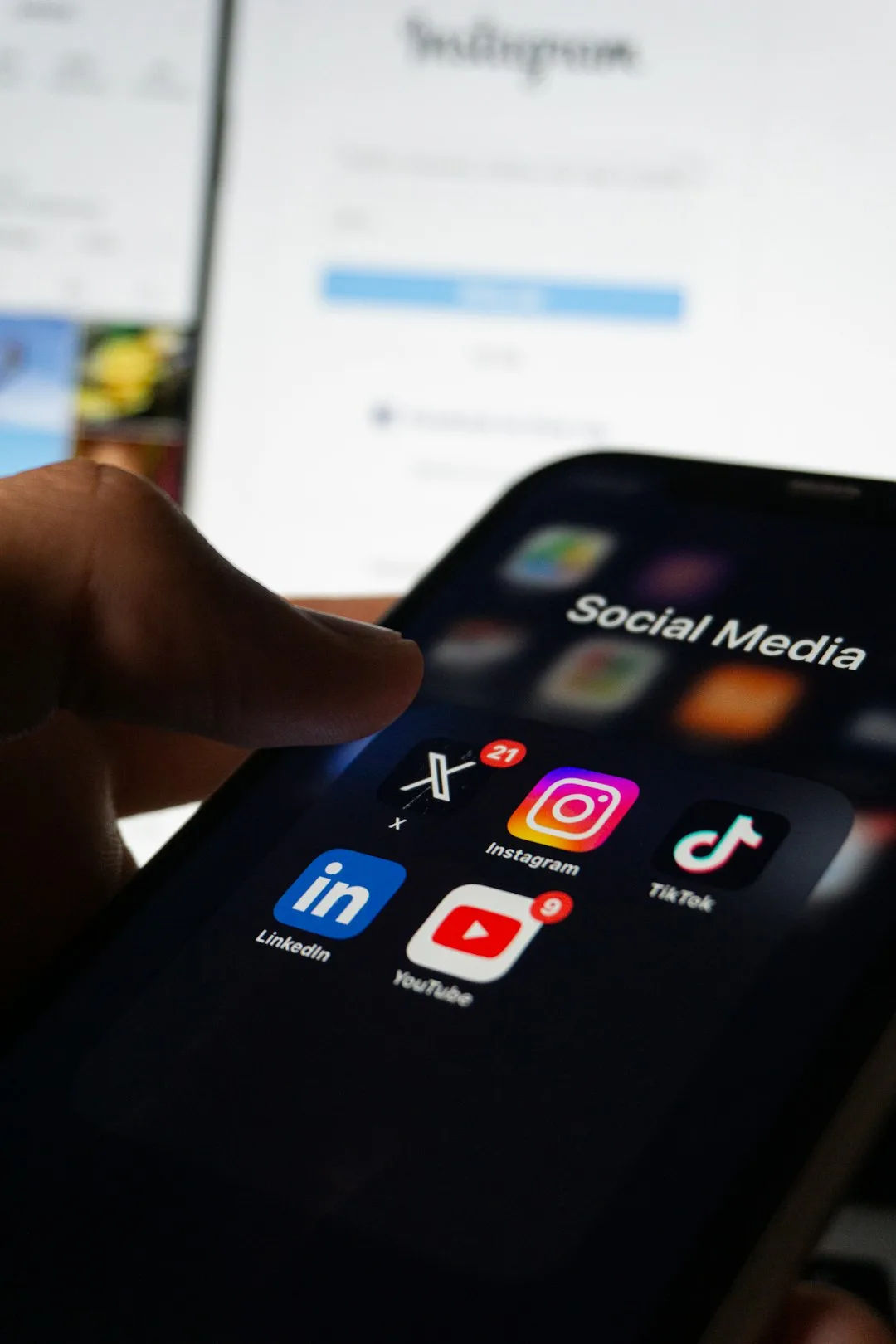 Smartphone showing a social media feed with branded posts