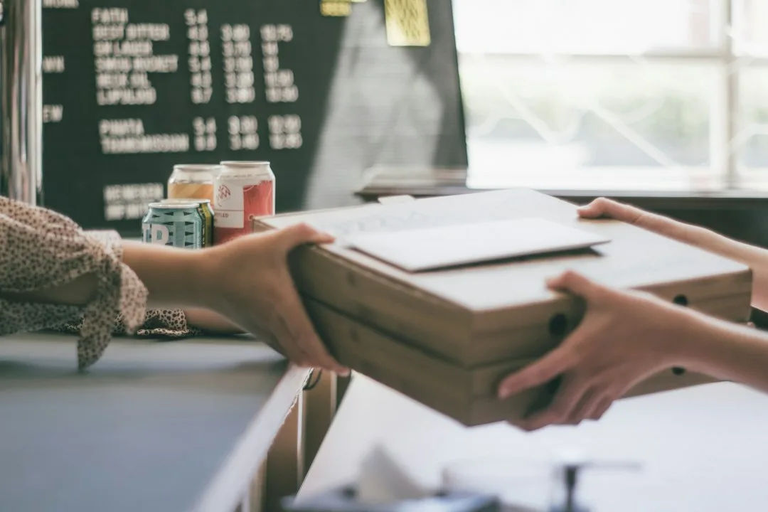 Small business owner packing an online order
