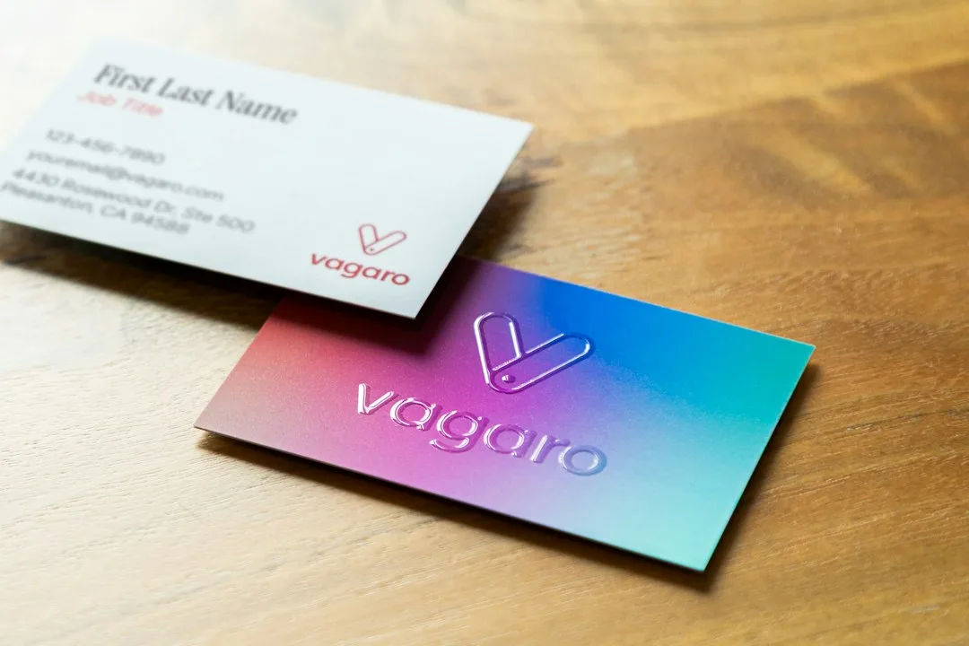 Brand identity colour swatches, typography and logo on a desk