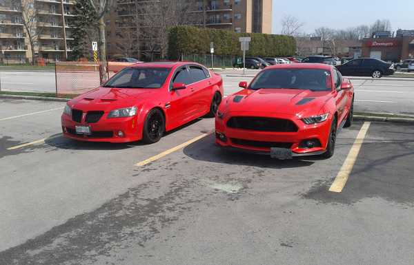 Parked next to my friends 2015 mustang gt