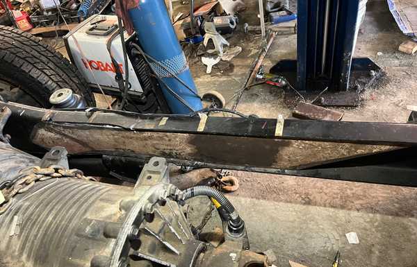 3/8" plate cut and ground to fit snug. The front is bent to accommodate the shape of the Ford frame using a shop press. 3/8" plate cut and ground to fit snug. The front is bent to accommodate the shape of the Ford frame using a shop press.