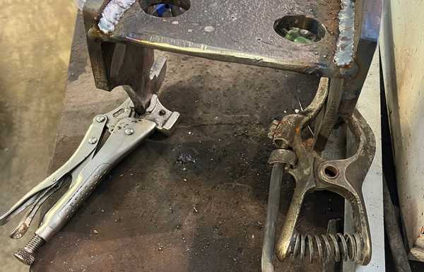 After tacking together on the frame, I removed the mount for more welding. I am not a welder, but I am confident that this will work just fine. There was good bevels cut with the plasma cutter, and ground cleanly, and welded with several passes. My little 180 amp welder can't do any more than this.
Incidently, Rich just made mounts for his Hybrid Land Cruiser ( on Youtube), and I saw that his design for mounts was pretty much the same as what I had just made. I feel pretty good about that. His were just smaller (1/4" plate instead of 1/2"). After tacking together on the frame, I removed the mount for more welding. I am not a welder, but I am confident that this will work just fine. There was good bevels cut with the plasma cutter, and ground cleanly, and welded with several passes. My little 180 amp welder can't do any more than this.
Incidently, Rich just made mounts for his Hybrid Land Cruiser ( on Youtube), and I saw that his design for mounts was pretty much the same as what I had just made. I feel pretty good about that. His were just smaller (1/4" plate instead of 1/2").