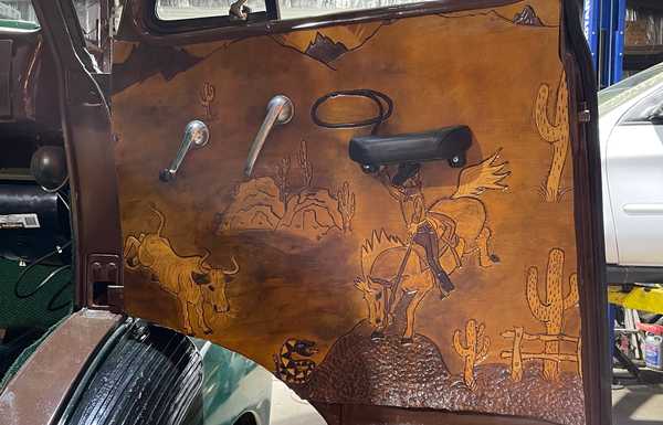 Custom hand tooled leather door panels 