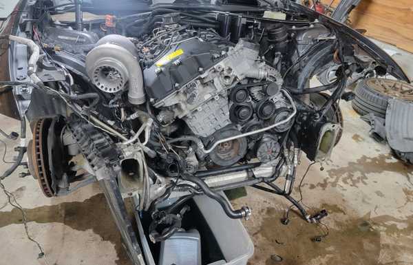 Front clip removed to pull the tired original engine out. Front clip removed to pull the tired original engine out.