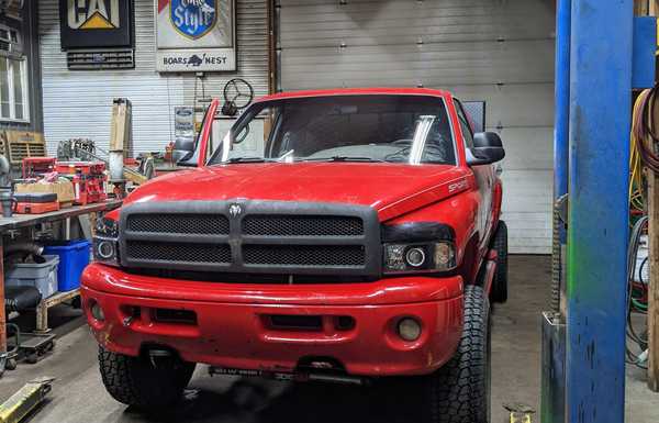 Sport bumper modified to accommodate tow hooks 