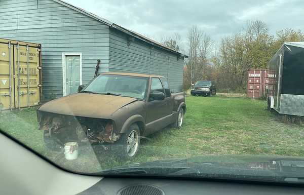 Project truck before pulling the V6. Donor vehicle in the background