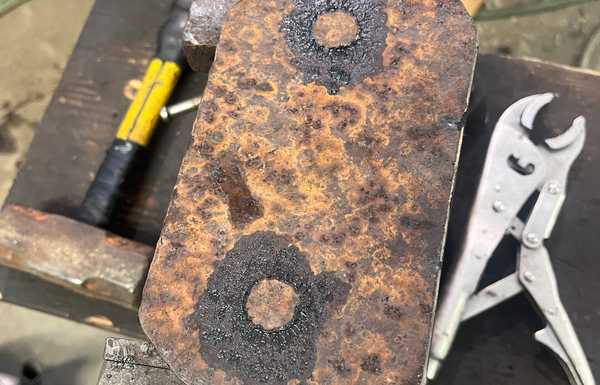 I dabbed some brake grease on the top of the pucks to mark exactly where to drill the holes. I dabbed some brake grease on the top of the pucks to mark exactly where to drill the holes.