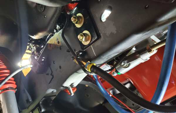 Bell crank mount driver side wheel well