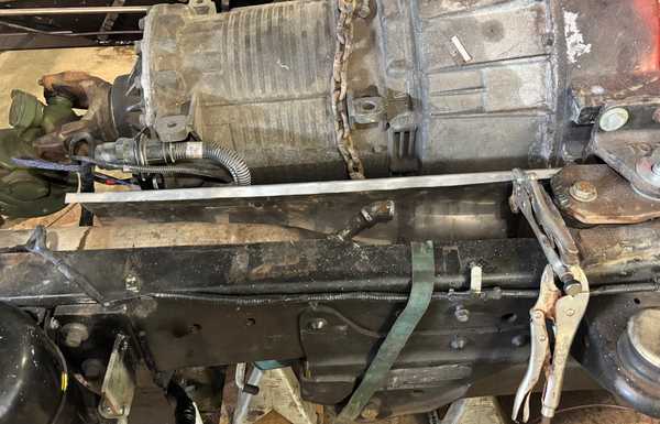 Constructing a heat shield to protect the transmission wiring Constructing a heat shield to protect the transmission wiring