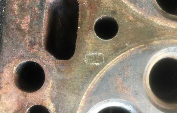 He left a piece of metal between the head and block... He left a piece of metal between the head and block...