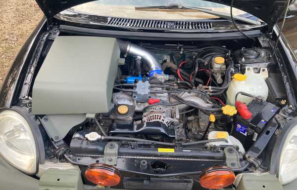 EJ25 boxer engine, with the custom exhaust and intake it does 0-60mph in 8.0 seconds, much faster then a stock Neon or Forester. EJ25 boxer engine, with the custom exhaust and intake it does 0-60mph in 8.0 seconds, much faster then a stock Neon or Forester.