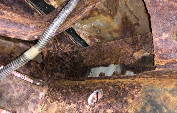 Rear, spare-tire bay surface rust galore