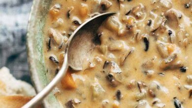 Instant Pot Wild Rice soup in bowl with spoon.