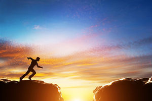Law of Assumption 10 Man running fast to jump over precipice between two mountains.
Concepts of determination, business, challenge, success, risk etc.