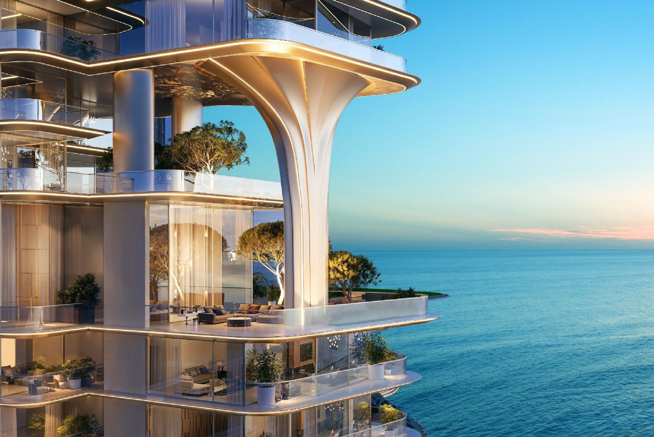 View of Yachtside Marina Residences at sunset with buildings, palm trees, and beach