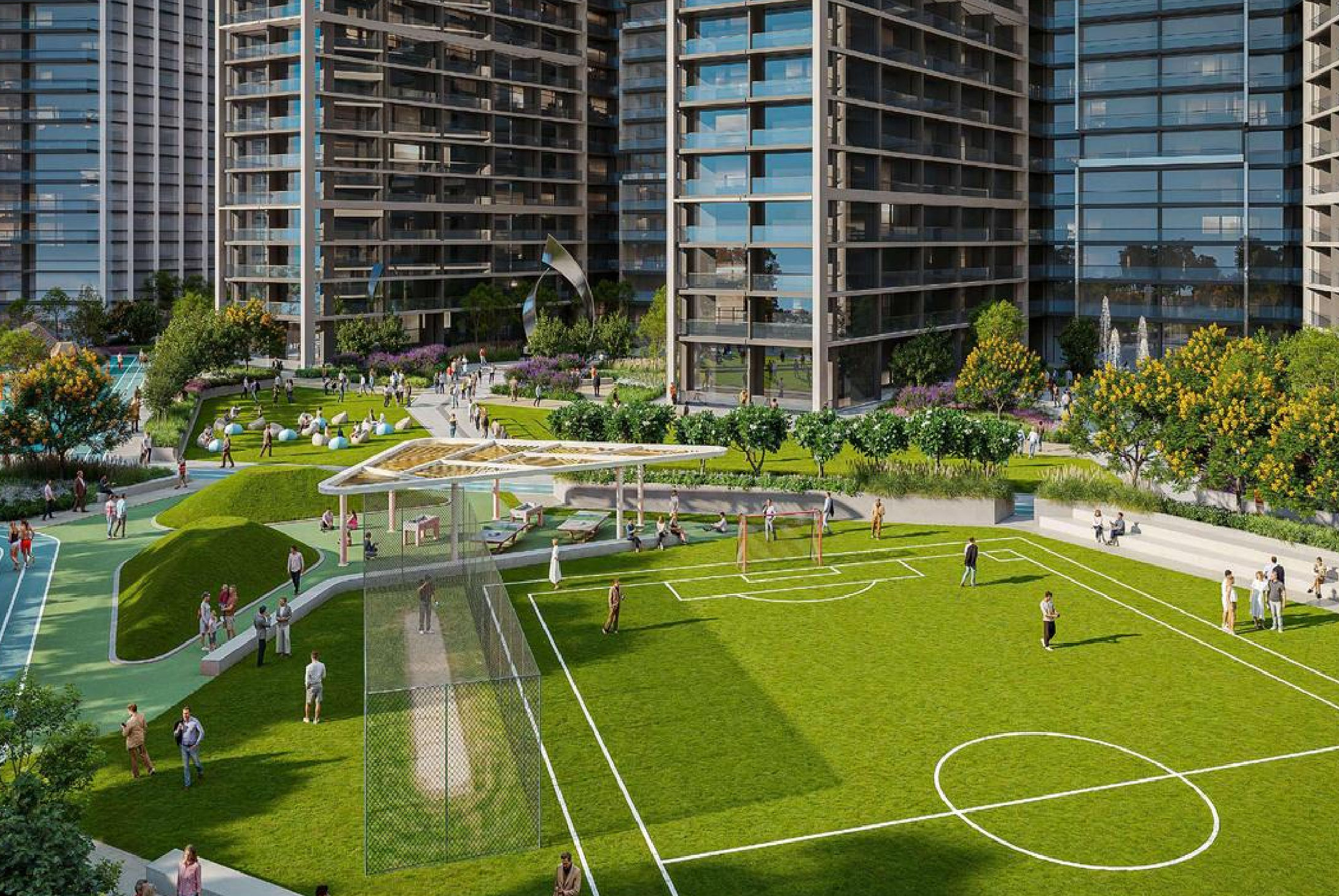 View of Yachtside Marina Residences at sunset with buildings, palm trees, and beach