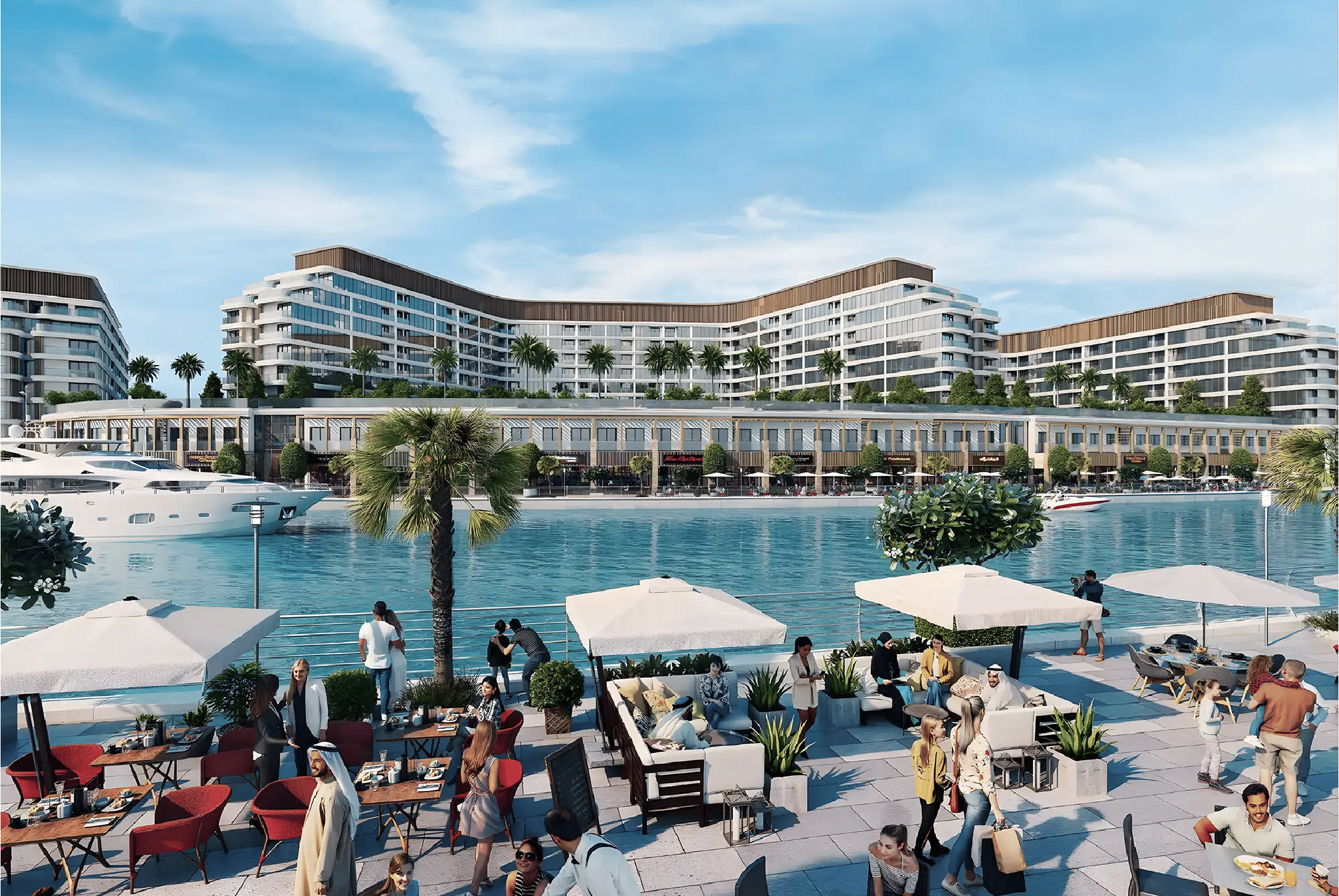 View of Yachtside Marina Residences at sunset with buildings, palm trees, and beach