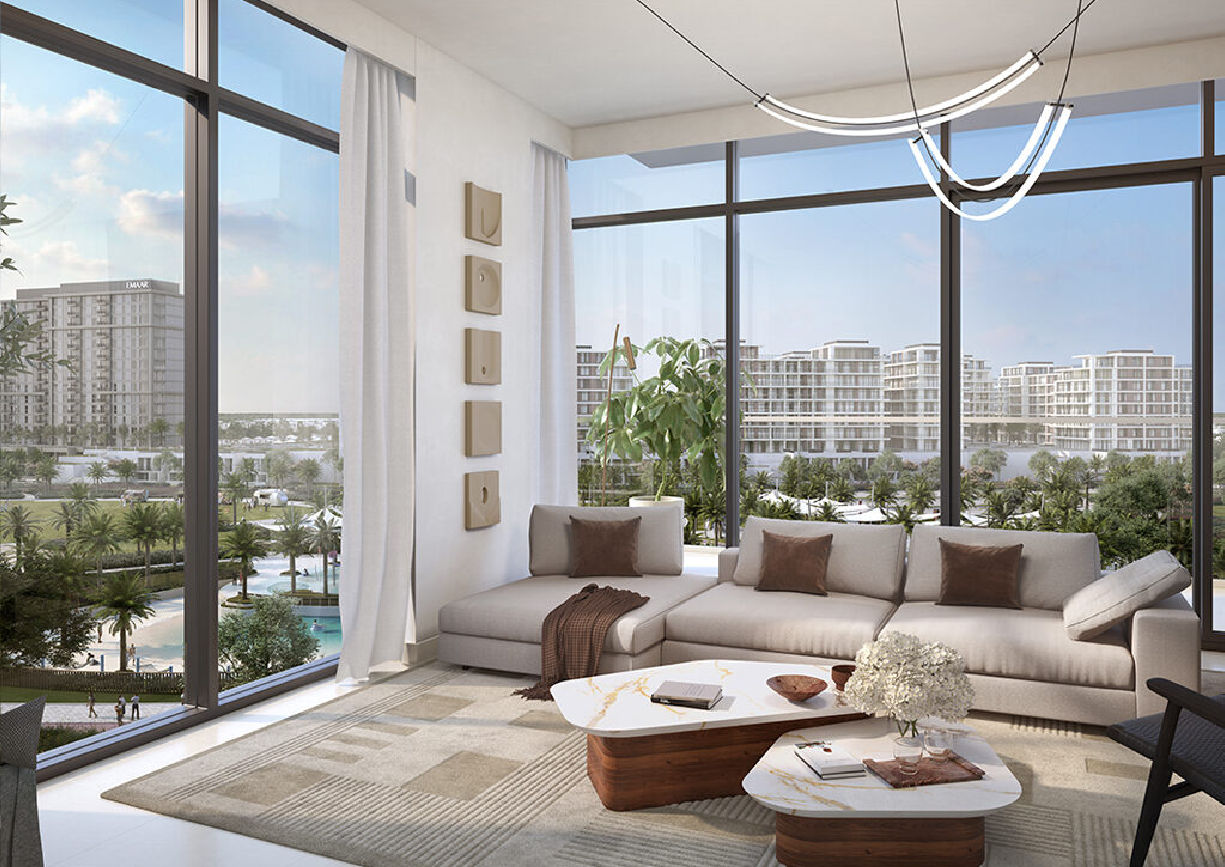 View of Yachtside Marina Residences at sunset with buildings, palm trees, and beach