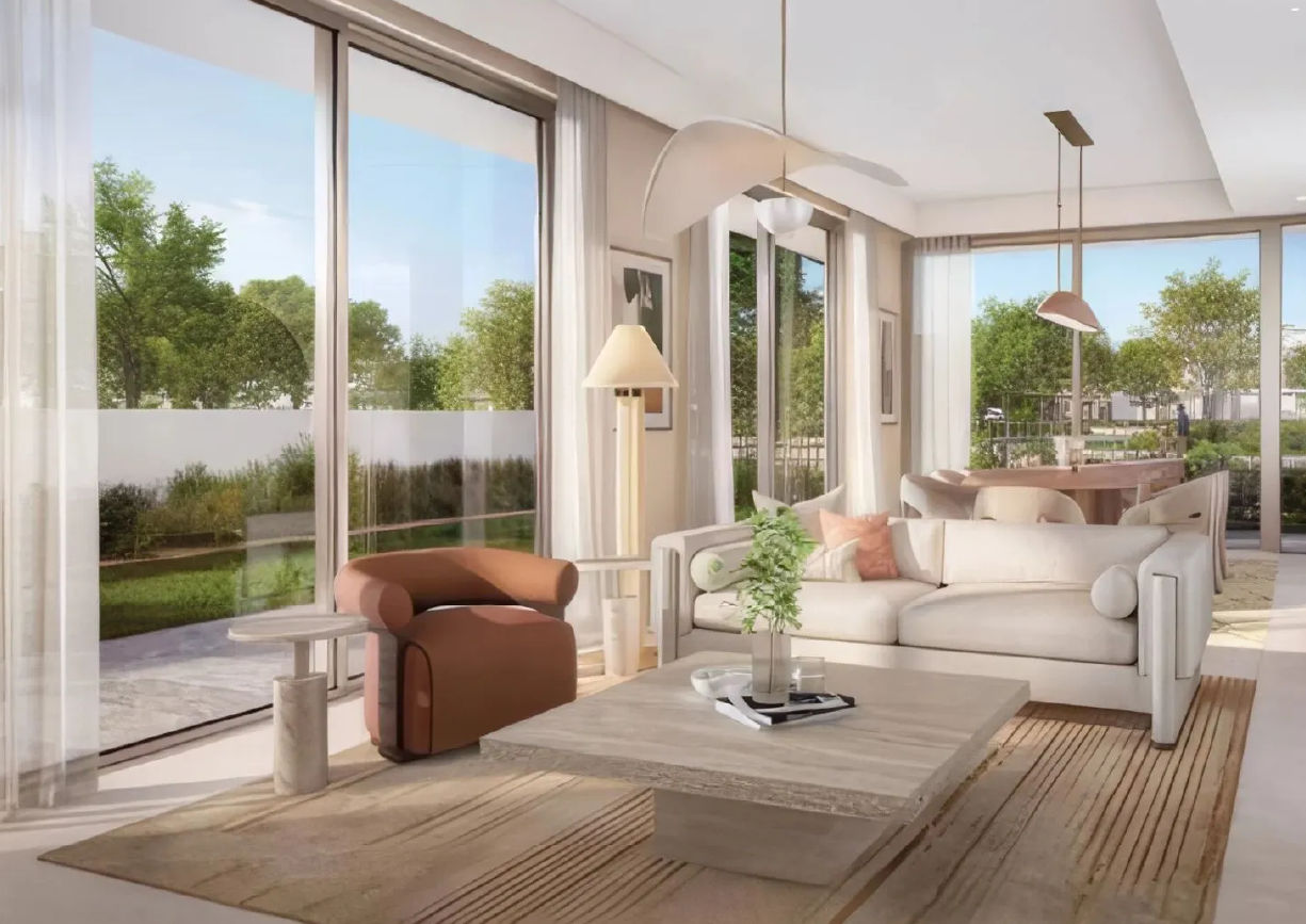 View of Yachtside Marina Residences at sunset with buildings, palm trees, and beach