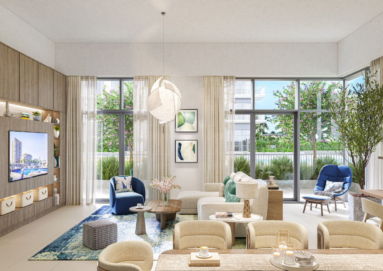 View of Yachtside Marina Residences at sunset with buildings, palm trees, and beach