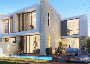 View of Yachtside Marina Residences at sunset with buildings, palm trees, and beach