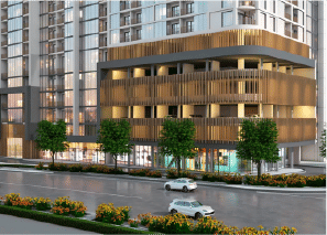 View of Yachtside Marina Residences at sunset with buildings, palm trees, and beach