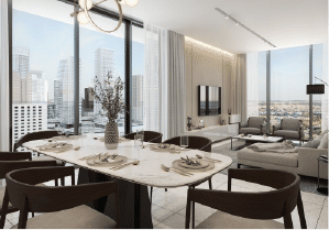 View of Yachtside Marina Residences at sunset with buildings, palm trees, and beach