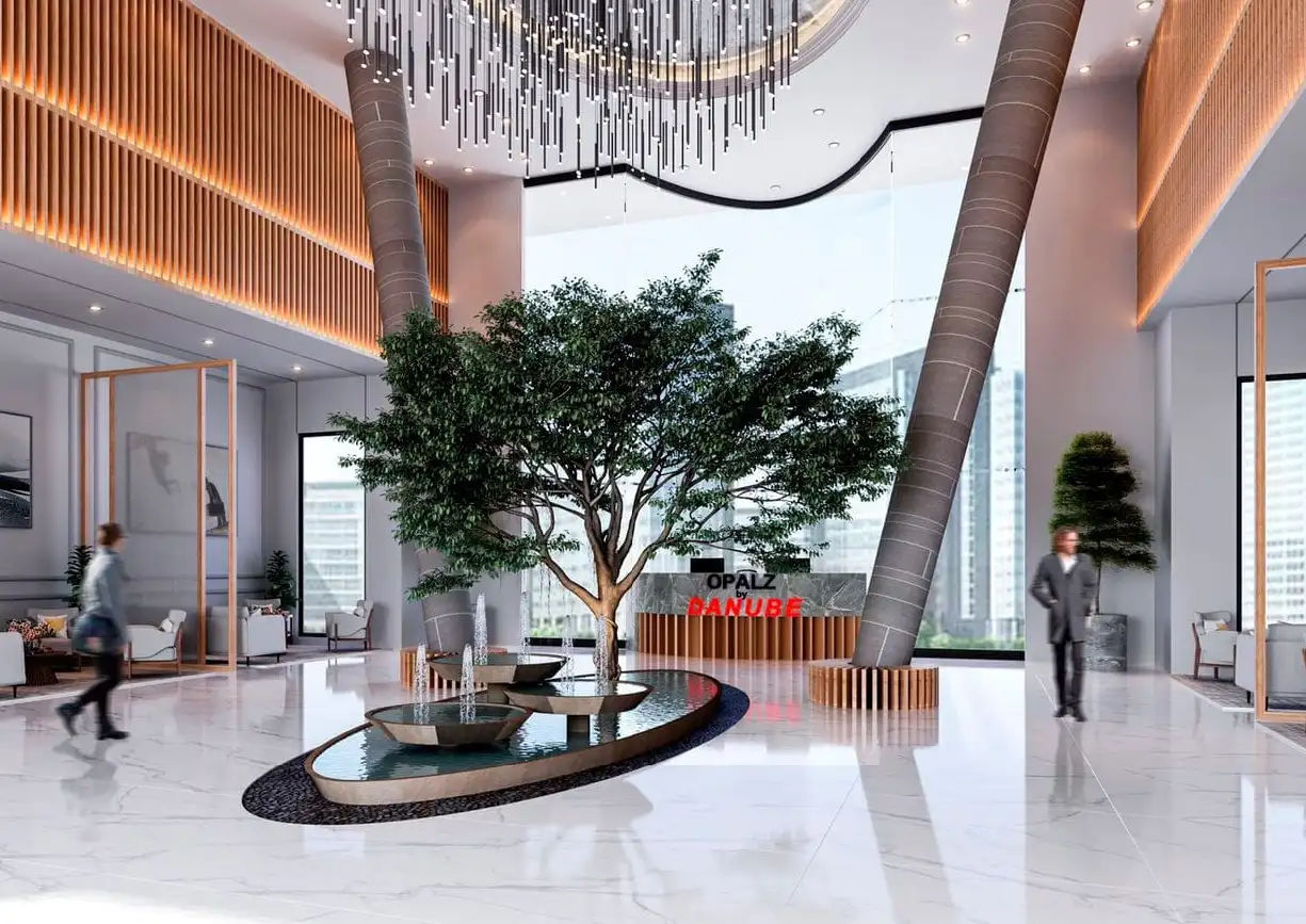 View of Yachtside Marina Residences at sunset with buildings, palm trees, and beach