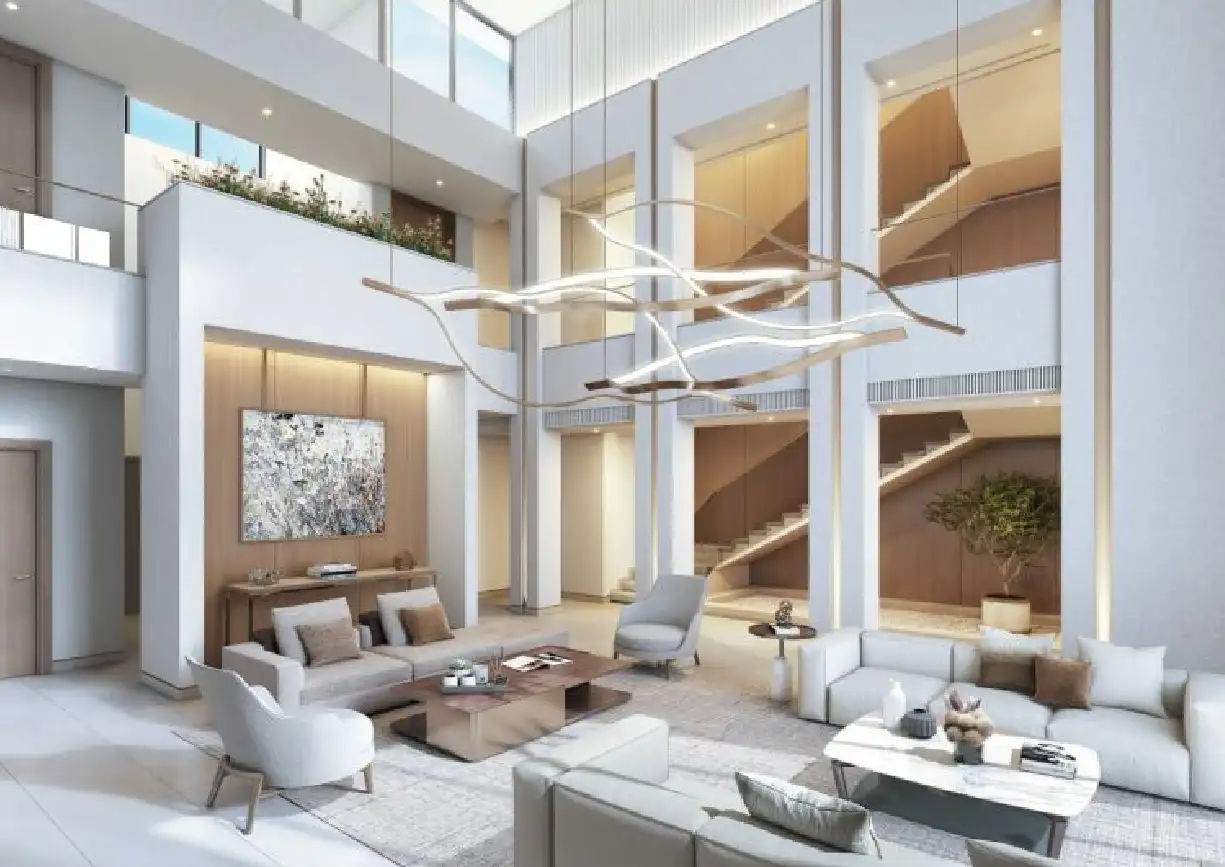 View of Yachtside Marina Residences at sunset with buildings, palm trees, and beach