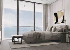 View of Yachtside Marina Residences at sunset with buildings, palm trees, and beach