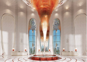 View of Yachtside Marina Residences at sunset with buildings, palm trees, and beach