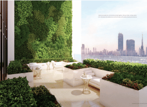 View of Yachtside Marina Residences at sunset with buildings, palm trees, and beach