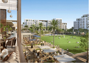 View of Yachtside Marina Residences at sunset with buildings, palm trees, and beach